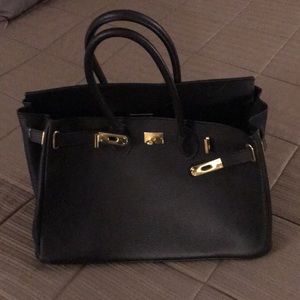 Black leather bag (no brand name)